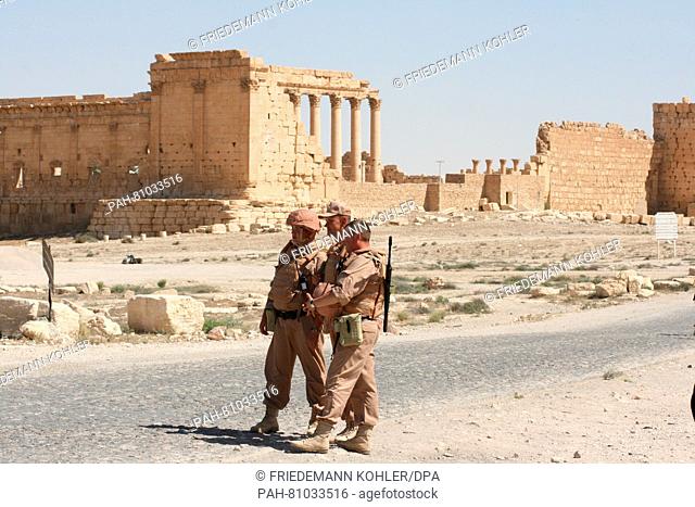 Members of the Russian Armed Forces pose next to the ancient ruins in Palmyra,  Syria, 05 May 2016. Syrian troups, supported by the Russian Armed Forces