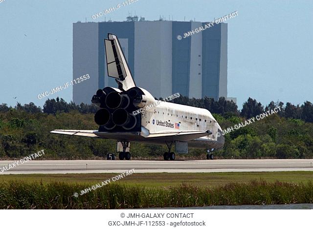 Space shuttle Discovery rolls to a stop on Runway 15 at the Shuttle Landing Facility at NASA's Kennedy Space Center in Florida. Landing was at 11:57 a