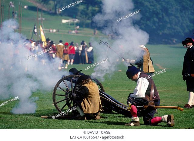 Reconstruction of Battle of Preston. Men firing small cannon / gun on wheels. Avenham Park. Preston