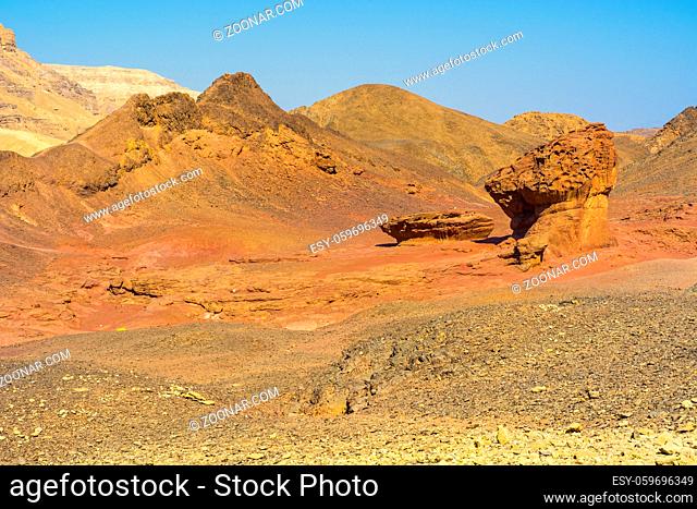Rocky hills of the Negev Desert in Israel. Breathtaking landscape of the rock formations in the Southern Israel. Dusty mountains interrupted by wadis and deep...