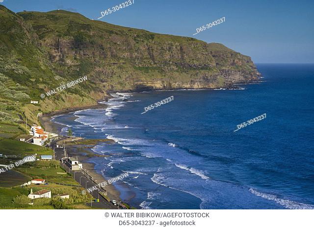 Portugal, Azores, Santa Maria Island, Praia, elevated view of town and Praia Formosa beach, late afternoon