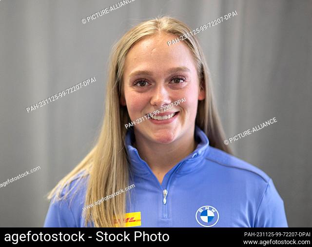 24 November 2023, Saxony, Dresden: Luger Anna Berreiter stands on the sidelines of the press conference of the German Bobsleigh and Luge Federation ahead of the...