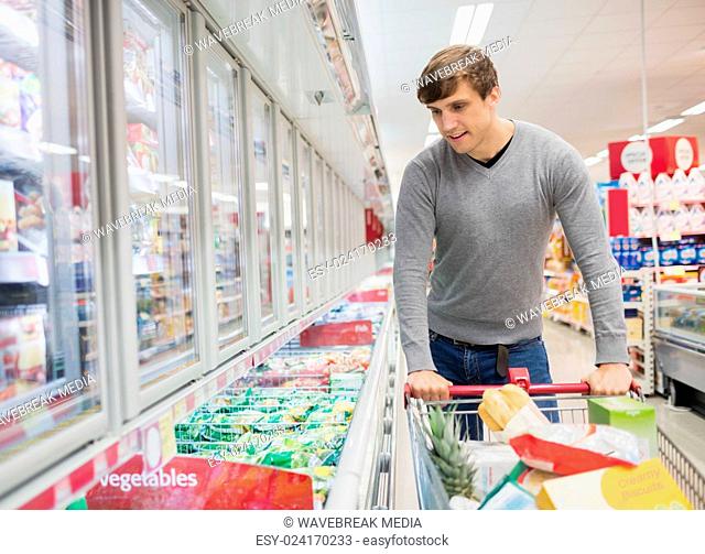 Front view of man choosing products
