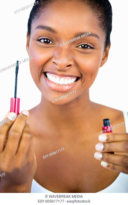 Smiling woman showing her mascara