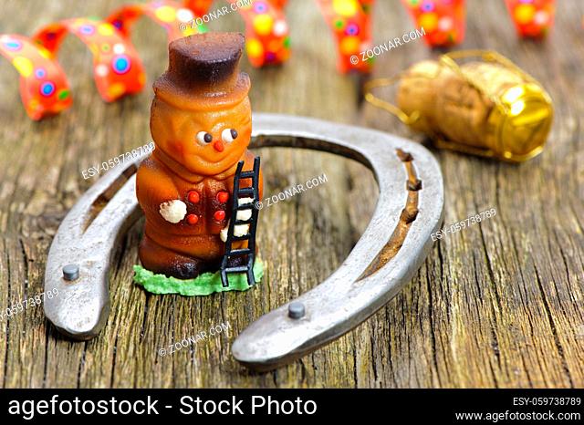 horse shoeand marzipan chimney sweeper as talisman for new years 2017
