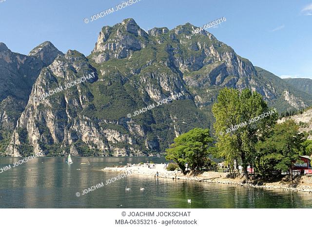 Tourists on the beach of Torbole, Lake Garda, province Trento, Trentino South Tirol, Italy