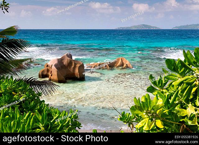 Seychelles with a turqouise water and big stones and lot of green plants