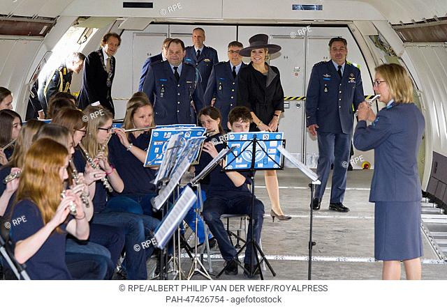Dutch Queen Maxima (hat) visit the project 'Young Musicians Spread Their Wings' on the airbase Eindhoven, The Netherlands, 26 March 2014