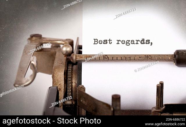 Close-up of a vintage typewriter, old and rusty, best regards