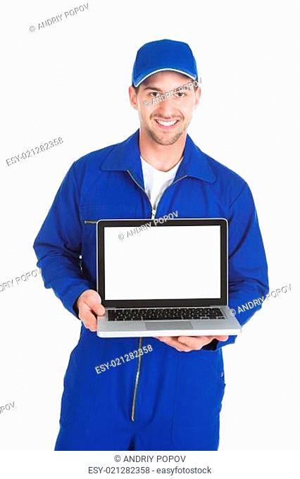 Mechanic Displaying Laptop Over White Background