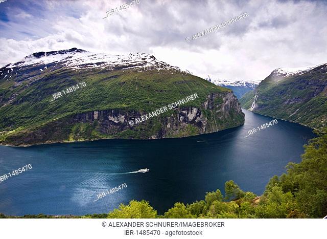 Panoramic view of the Geiranger Fjord from the eagle eyes view Ørnesvingen with the waterfalls The Seven Sisters and the ferry to Hellesylt, Norway, Scandinavia