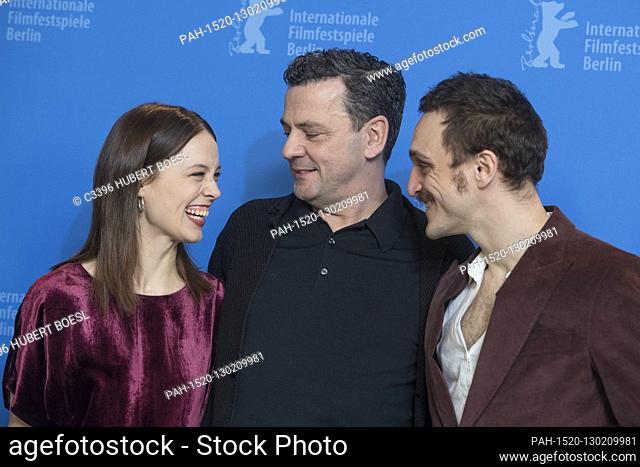 Paula Beer (l-r), Christian Petzold and Franz Rogowski pose at the photo call of 'Undine' during the 70th Berlinale International Film Festival at Hotel Hyatt...