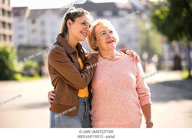 Granddaughter embracing her grandmother