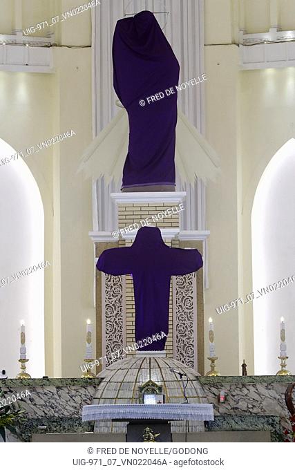 Gia Dinh Church. A Lenten Tradition: Veiling the Cross for Passiontide. Holy Thursday. Ho Chi Minh City. Vietnam