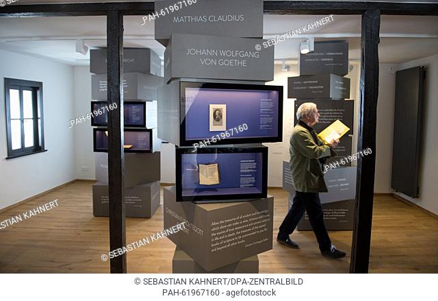 A journalist walks through the permanent exhibition 'Luther und die Bibel' (lit. Luther and the bible) at the Lutherhaus (Luther House) in Eisenach,  Germany