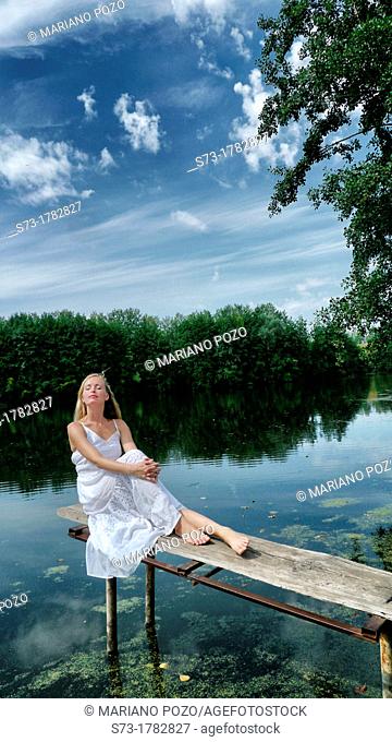 Woman on the pier in Lake Avral, Kirillovka, Samara Region, Russian Federation