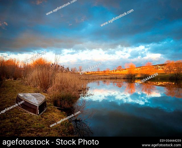 boat on a small lake with reflection in Burgenland