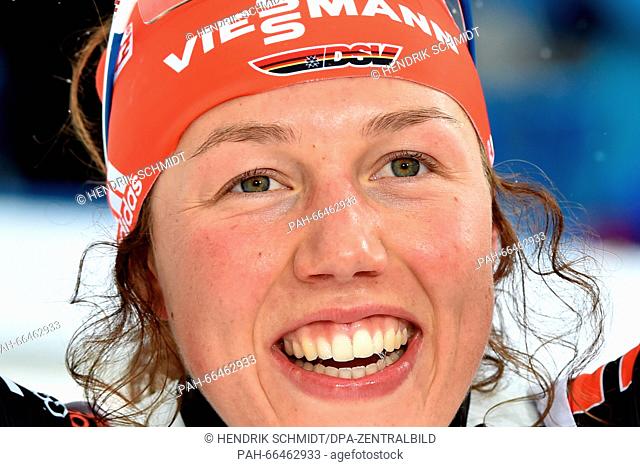 Biathlete Laura Dahlmeier of Germany celebrates while crossing the finish line to win the womens's 10km pursuit competition at the Biathlon World Championships