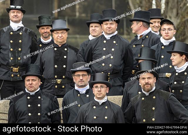 27 April 2022, Saxony, Dresden: Chimney sweeps pose in front of the Christuskirche Dresden-Strehlen after a festive service with flag dedication of the Chimney...