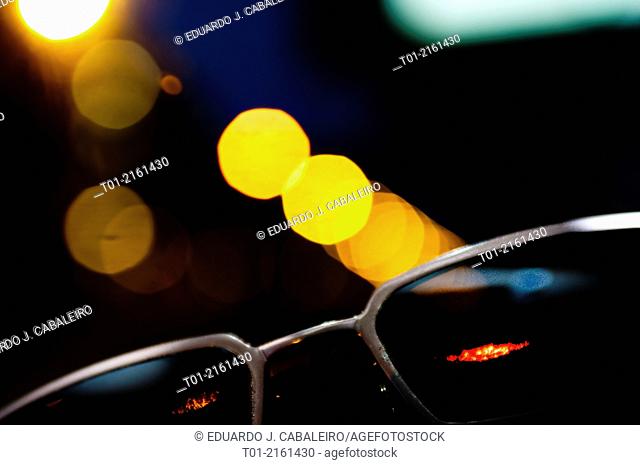 sunglasses with city lights background