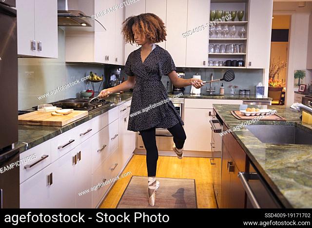 Ballet dancer cooking in a residential kitchen