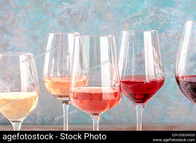 Wine colors. Many glasses of wine, side view