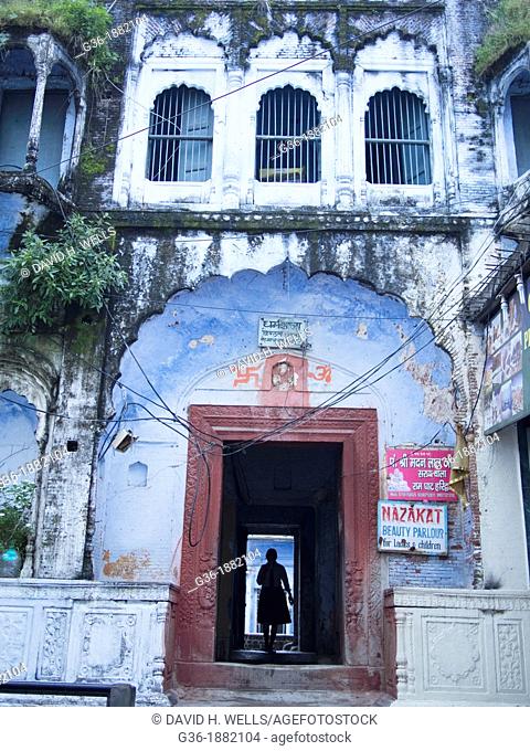 A woman passes through a doorway in Haridwar in the state of Uttarakhand in northern India