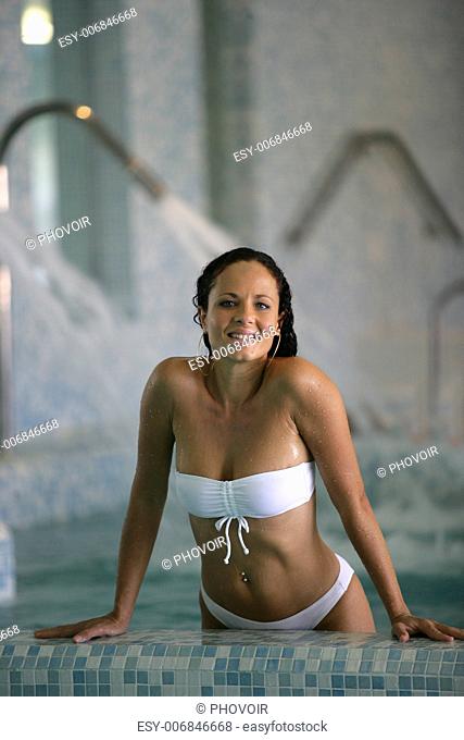 woman relaxing in a spa center pool