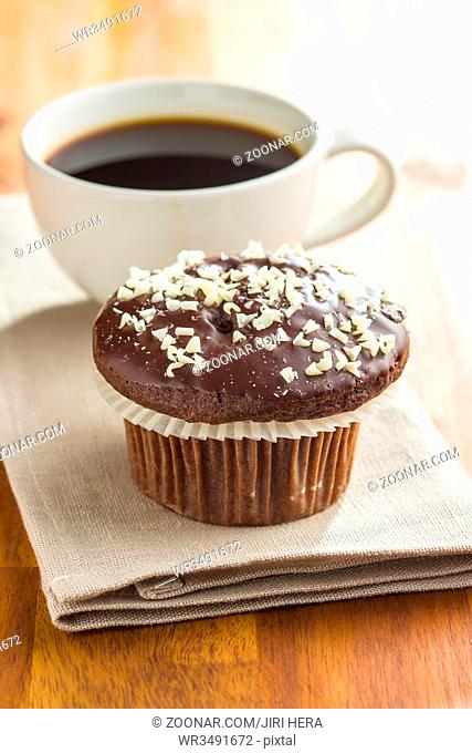 Tasty chocolate muffins. Cupcakes and coffee cup