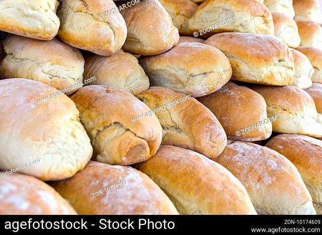 Traditional hand-made bread. Pile of hand made bread