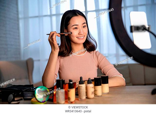 Young women live online makeup