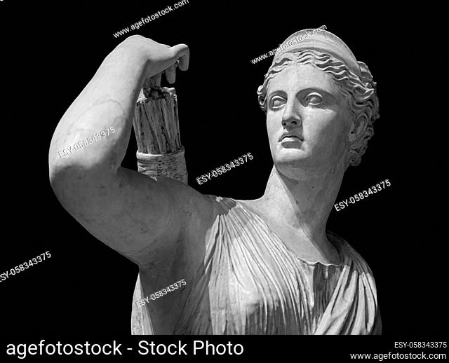 Classic white marble statuette Diana of Versailles isolated on black background. Scilpture of huntress