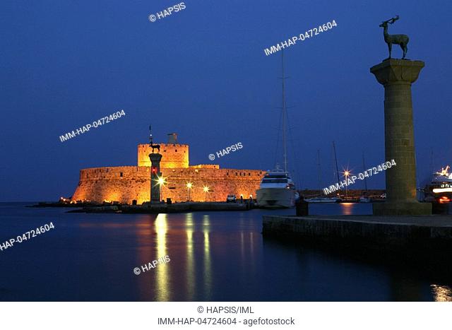 Rhodes Town, Mandraki harbor entrance, bronze deer, Agios Nikolaos fortress & lighthouse, night, Rhodes, Dodecanese, Greece
