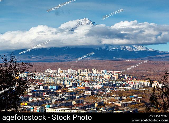 Kamchatka autumn view of city landscape of Petropavlovsk-Kamchatsky City on background beautiful active Koryaksky Volcano