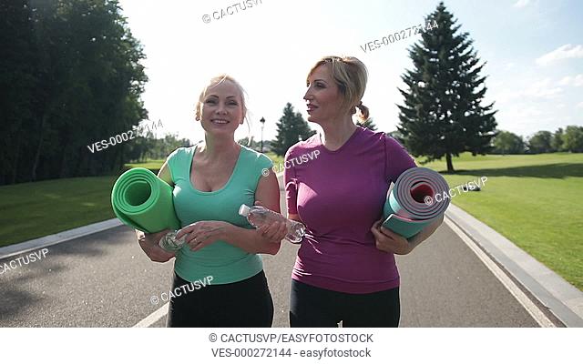 Active senior women going to train outdoors