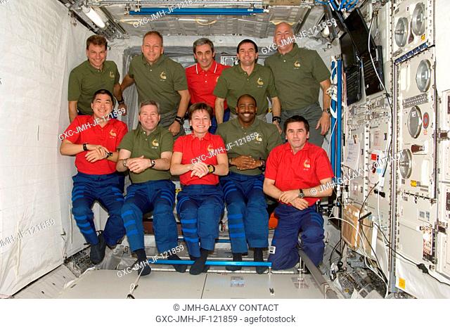STS-122 and Expedition 16 crewmembers pose for a group photo following a joint news conference in the Columbus laboratory of the International Space Station...