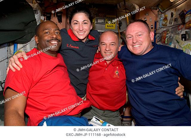Astronauts Leland Melvin (left) and Nicole Stott, both STS-129 mission specialists; along with Jeffrey Williams, Expedition 21 flight engineer; and Barry E
