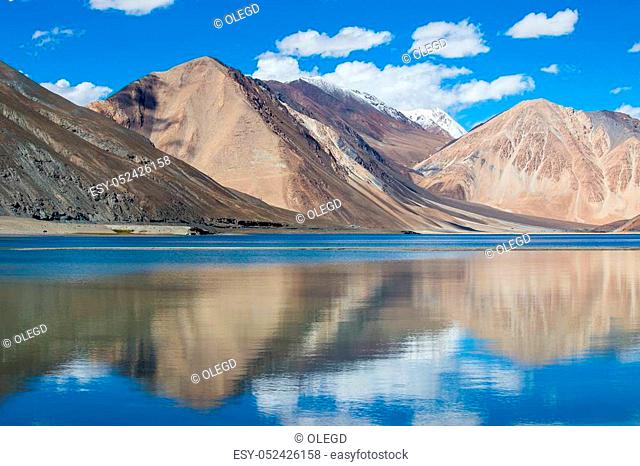 Sunny day at Pangong Lake. Pangong Lake, is an endorheic lake in the Himalayas situated at a height of about 4, 350 m. It is 134 km long and extends from India...