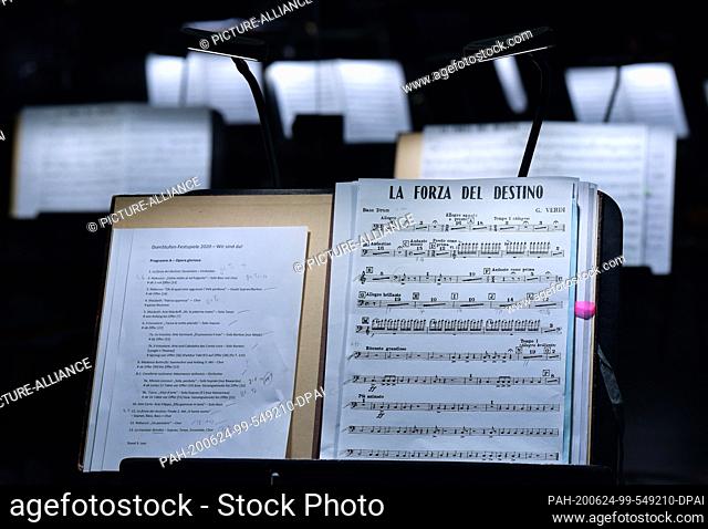 24 June 2020, Thuringia, Erfurt: Music stands for the musicians of the Erfurt Theatre Philharmonic Orchestra will be on stage during a rehearsal for this year's...