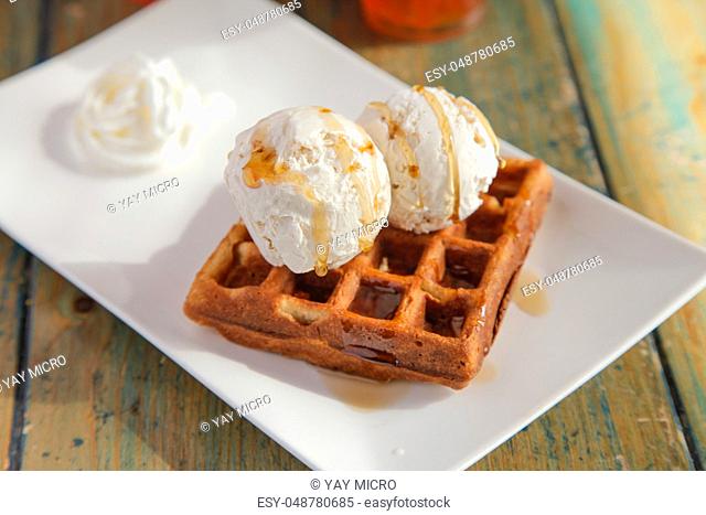 Two scoops of Vanilla caramel ice cream waffle sundae