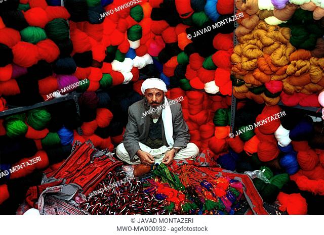 An Iarnian merchant sittin in his cloth shop in Zahedan city of Sistan & Balouchistan south eastern province of Iran