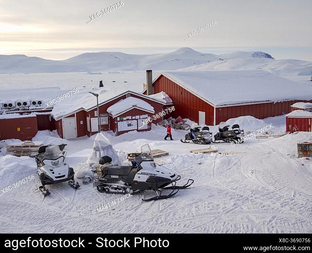 Snowmobiles in front of the only store. The traditional and remote greenlandic inuit village Kullorsuaq located at the Melville Bay, part of the Baffin Bay