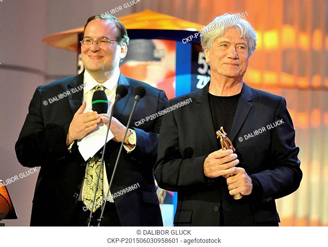 German actor Jurgen Prochnow, right, receives award for his life contribution to cinematography at the closing ceremony of the 55th International Film Festival...