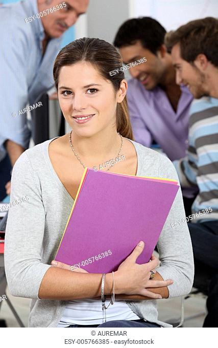 a girl posing in a classroom