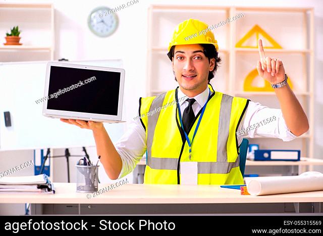 Male construction engineer working in the office