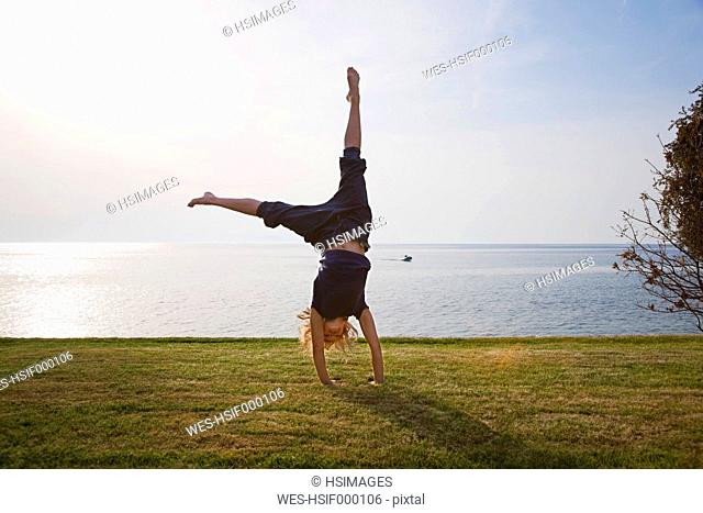 Girl handstand ocean Stock Photos and Images | agefotostock