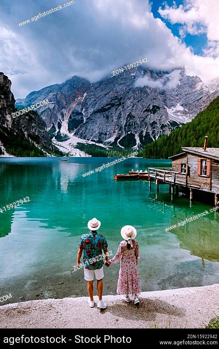 couple visit the famous lake Lago Di Braies Italy, Pragser Wildsee in South Tyrol, Beautiful lake in the italian alps, Lago di Braies