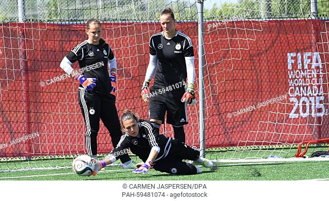 Germany's goalkeeper Nadine Angerer during a training session with the second goalkeeper Almuth Schult (R) and third goalkeeper Laura Benkarth at the FIFA...