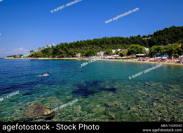 Bathing beach at fishing port, capital Limenas, Thassos, Greece