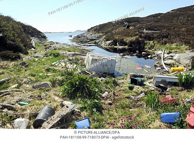 24 May 2018, Norway, Bergen: Garbage lies on a small island off the city of Bergen. For decades, the current has washed ashore here what people have carelessly...